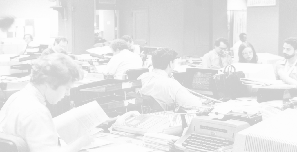 An archival office scene, with people working across desks, documents, and machines